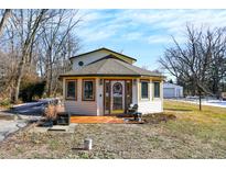 Quaint circular home with deck and mature trees at 5121 Cordes Rd, Indianapolis, IN 46227