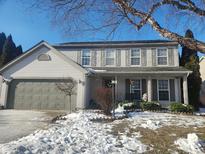 Two-story house with gray siding, attached garage, and landscaping at 5634 Dapple Ct, Indianapolis, IN 46228