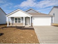 Charming single-story home featuring a two-car garage, and tasteful vinyl siding at 1208 Fleming Dr, Greenfield, IN 46140