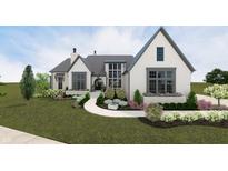 Elegant home featuring a bright white brick facade, complemented by a charming, professionally landscaped front yard at 1461 Chatham Ridge Ct, Westfield, IN 46074