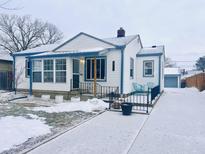 Charming ranch home with a snow-covered yard and a welcoming front porch at 3305 S New Jersey St, Indianapolis, IN 46227