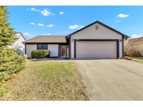 Charming single-story home featuring a two-car garage, well-maintained lawn, and classic curb appeal at 3631 Foxtail Dr, Indianapolis, IN 46235