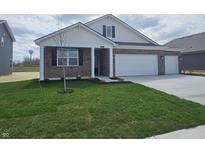 Charming single-story brick home with a two-car garage and well-manicured lawn at 6033 Granby Dr, Whitestown, IN 46075