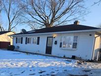 Charming single-story home featuring vinyl siding, updated windows, and a well-maintained front yard at 3130 Chrysler St, Indianapolis, IN 46224