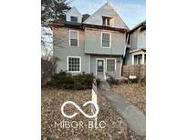 Charming two-story home with detailed framework, awaiting your personal touch to restore it to its former glory at 340 W 11Th St, Anderson, IN 46016