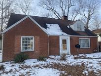 Brick ranch house with a snow-covered yard at 915 Raible Ave, Anderson, IN 46011
