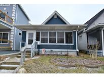 Charming single-story home with a front porch and inviting curb appeal at 1719 Fletcher Ave, Indianapolis, IN 46203
