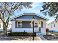 Charming gray and white bungalow with a welcoming front porch at 2743 Barth Ave, Indianapolis, IN 46203