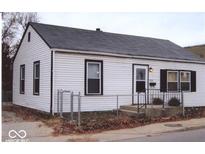 White house with black window frames and a chain link fence at 3726/3722/3716 N Emerson Ave, Indianapolis, IN 46218