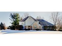 Two-story house with brick and siding, gray roof, and snowy front yard at 179 W Arcadia Way, Mooresville, IN 46158