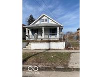 Charming home with a classic design and inviting front porch at 3048 Newton Ave, Indianapolis, IN 46201