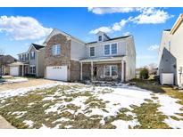 Two-story home with partial brick exterior, snow-covered lawn at 3174 Hemlock St, Whiteland, IN 46184