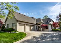 Brick house with three-car garage and manicured lawn at 1677 Ashwood Dr, Greenwood, IN 46143