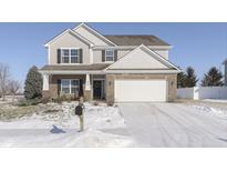 Two-story house with brick and siding, white garage door, and snow-covered lawn at 2248 Sante Fe Dr, Greenfield, IN 46140