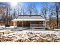 Charming one-story home with snow covered yard at 5155 W Big Hurricane Rd, Martinsville, IN 46151