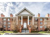 Brick building exterior with grand entrance and landscaping at 8650 Jaffa Ct W Dr # 12, Indianapolis, IN 46260