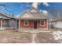 Charming orange bungalow with a front porch at 117 N Sheffield Ave, Indianapolis, IN 46222