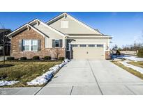 Brick and siding home with attached garage and landscaping at 3256 Jasper Ln, Brownsburg, IN 46112