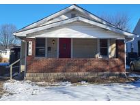 Charming bungalow with brick facade and red front door at 431 N 18Th Ave, Beech Grove, IN 46107