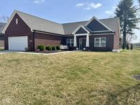 Charming brick ranch home with a manicured lawn and inviting entryway at 4543 W Meadows Ln, New Palestine, IN 46163