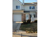 Two-story townhome with attached garage and landscaping at 5914 Mornay Dr, Indianapolis, IN 46254