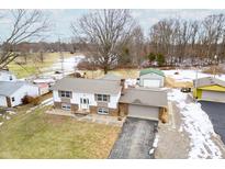 Ranch home with detached garage and expansive yard at 671 Knollwood Dr, Columbus, IN 47203