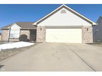 Brick ranch home with attached garage and landscaping at 9862 Herald Sq, Fishers, IN 46038