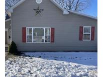 Gray house with red shutters, large window, and a star decoration at 1097 S 5Th St, Noblesville, IN 46060