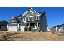 Two-story home with gray siding, white garage door, and brick accents at 6362 Springtide Ct, Plainfield, IN 46168