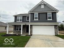 Beautiful two-story home featuring gray siding, white trim, and an attached two car garage at 7541 Big Bend Blvd, Camby, IN 46113
