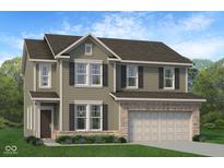 Charming two-story home features a brick-accented garage and covered entry, complemented by lush landscaping at 902 Stonehaven Dr, Indianapolis, IN 46239
