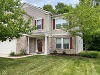 Two-story house with brick and siding, red shutters, and a well-manicured lawn at 10391 Butler Dr, Brownsburg, IN 46112