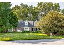 Charming single story home with brick accents, manicured lawn and mature trees at 1141 Pimbury Ct, Indianapolis, IN 46260