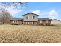 Charming two-story home with a brick facade and well-maintained lawn at 6293 N County Road 250 E, Pittsboro, IN 46167