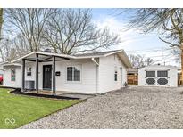 Newly renovated home with a modern exterior and detached garage at 4048 Breton St, Indianapolis, IN 46222