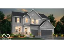Two-story home with gray siding, stone accents, and a two-car garage at 6403 Rippling Rock Dr, Plainfield, IN 46168