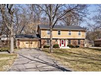 Charming two-story home with brick accents and a well-maintained front yard at 6826 E 65Th St, Indianapolis, IN 46220