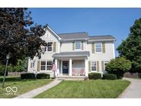 Two-story house with a front porch and landscaped lawn at 12738 Buff Stone Ct, Fishers, IN 46037