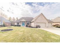 Brick home with two-car garage and landscaped lawn at 1297 Morningside Dr, Greenfield, IN 46140