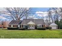 Charming brick home with a well-maintained front yard and double door entrance at 3521 Manchester Rd, Anderson, IN 46012