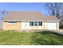 Ranch home with attached garage and landscaped lawn at 4102 Barnor Dr, Indianapolis, IN 46226