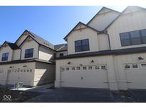 Inviting townhouse exteriors feature attached garages and classic neutral color scheme at 4183 Douro Trl, Westfield, IN 46062