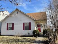 Charming one-story house with red shutters and a well-maintained lawn at 825 Birch Ave, Indianapolis, IN 46221
