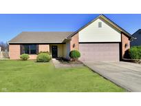 Brick ranch home with attached garage and well-manicured lawn at 8296 Eagles Nest Dr, Avon, IN 46123