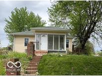 Charming home featuring a cozy enclosed porch and a welcoming entrance at 252 Ringwood Way, Anderson, IN 46013
