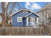 Blue house with wooden fence and yard at 2814 Brookside Ave, Indianapolis, IN 46218