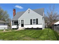 Charming single-story home with a well-maintained lawn and neutral siding, showcasing classic design elements at 3513 N Layman Ave, Indianapolis, IN 46218