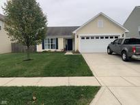 Ranch style home with attached garage and landscaped lawn at 857 Briarstone Dr, Greenwood, IN 46143