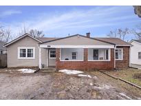 Cute ranch home features a covered porch and brick facade at 1743 Sparrow Ave, Indianapolis, IN 46227