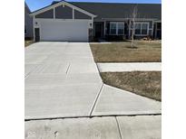Charming single-story home with a well-maintained lawn and concrete driveway leading to a two-car garage at 19438 Astoria Ave, Sheridan, IN 46069